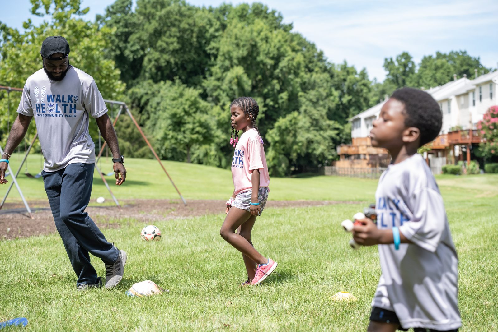 Royal Athletes coach engaging with kids at a community event